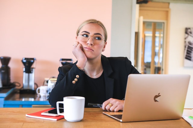 woman looking bored and unfulfilled at work